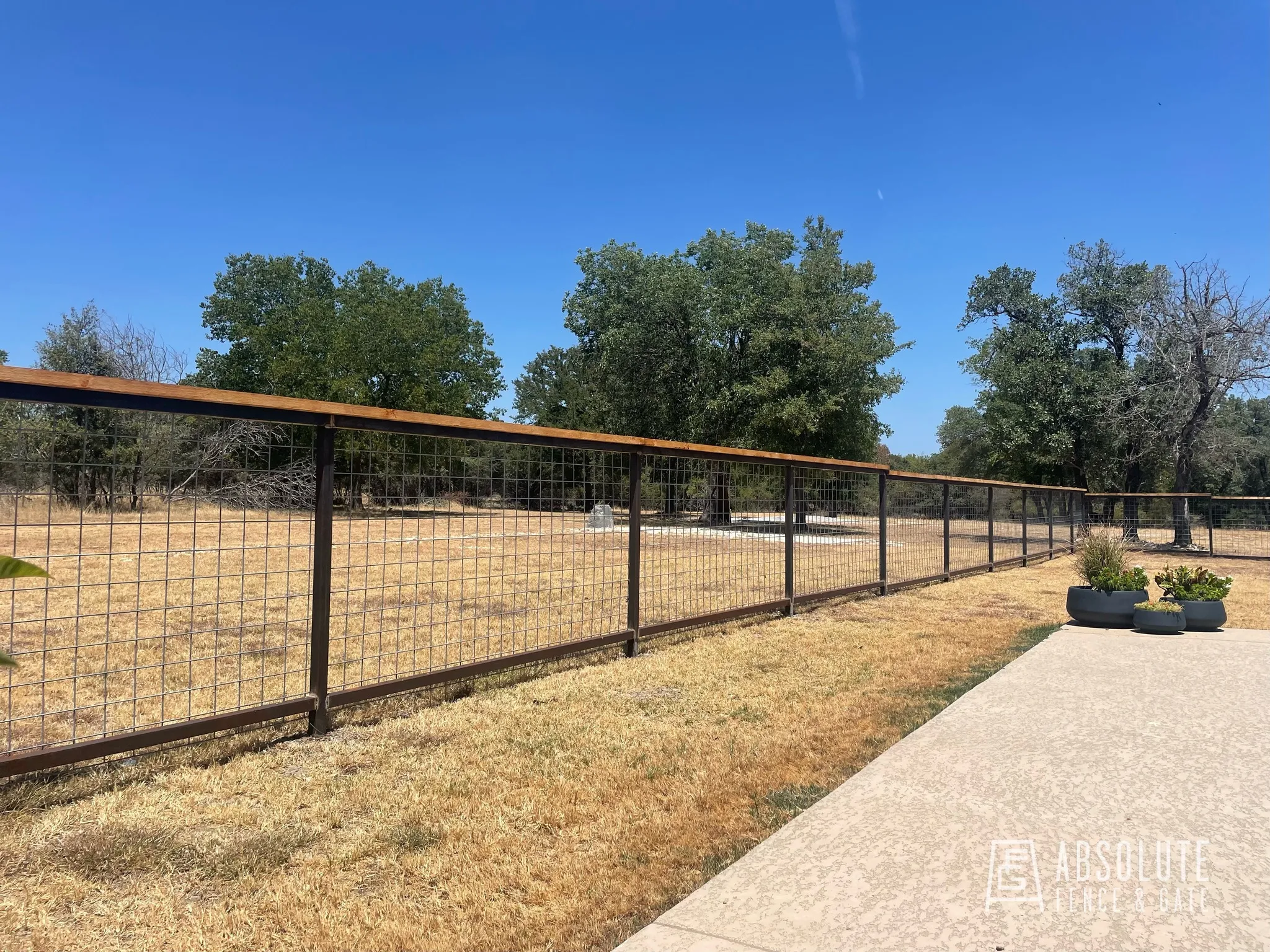 Bull panel ranch-style fence installed by Absolute Fence & Gate in Central Texas