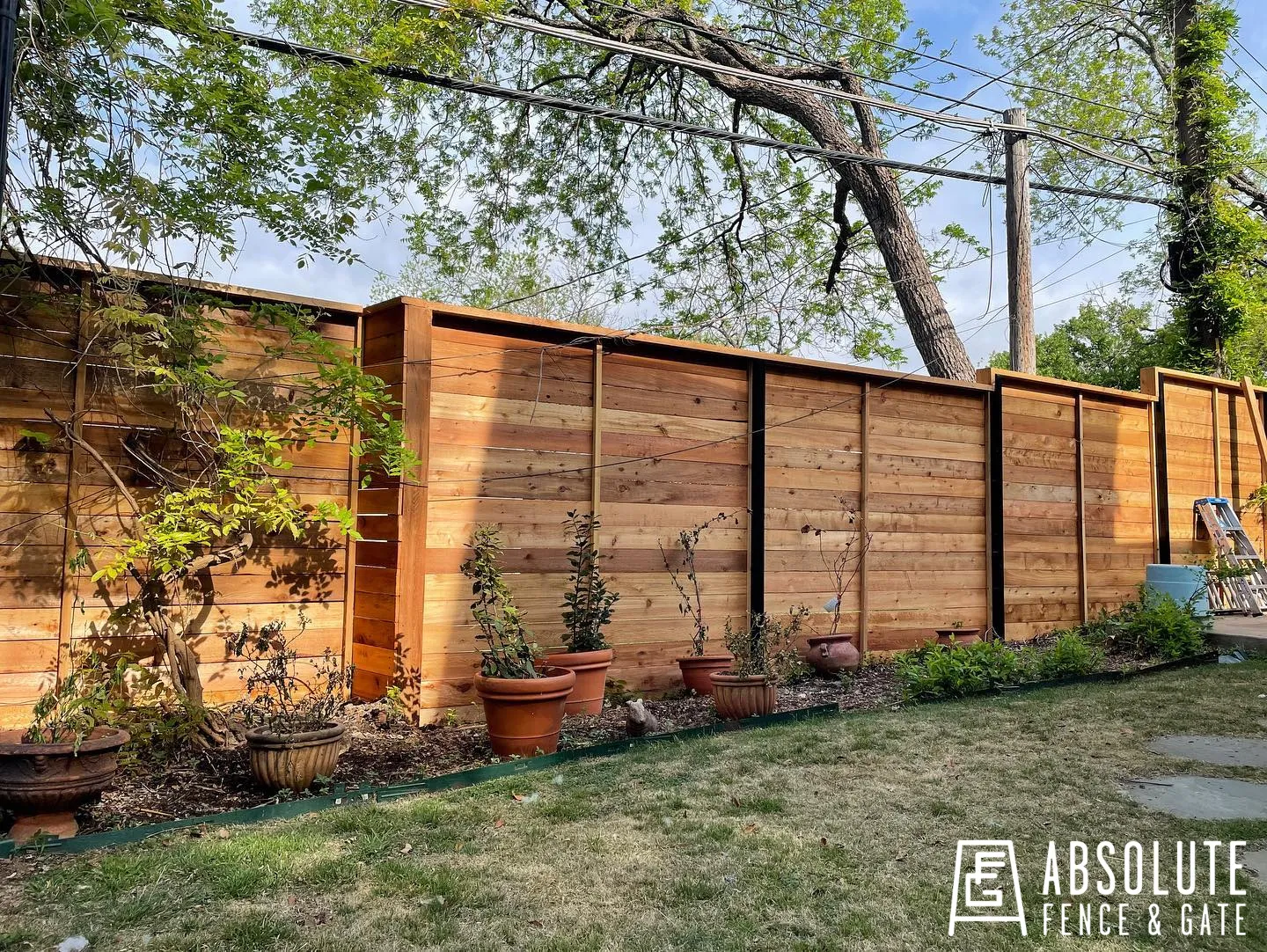 Horizontal wood fence installed by Absolute Fence & Gate
