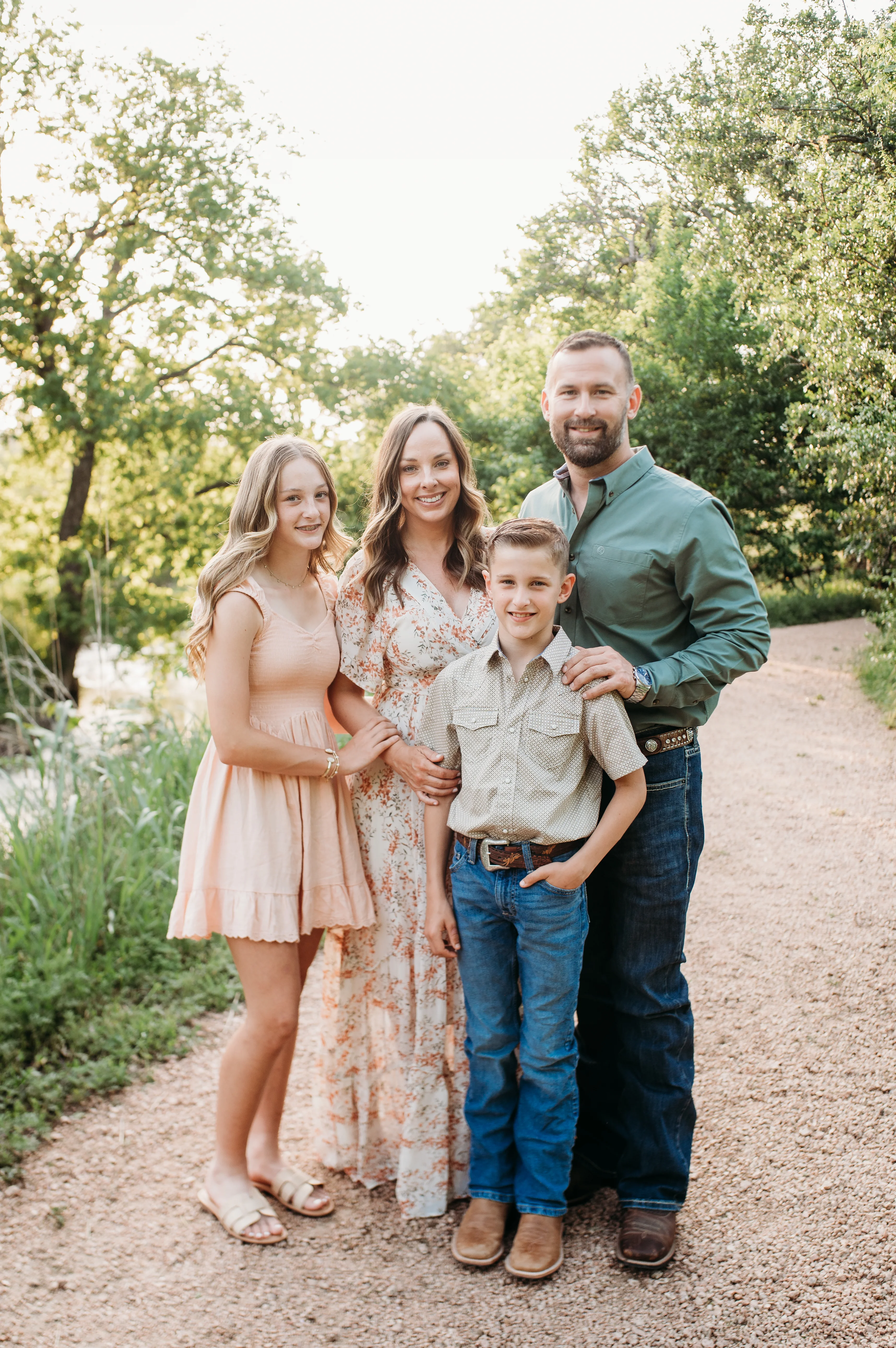 Travis and Amanda Powell with their family — owners of Absolute Fence & Gate in Austin, TX