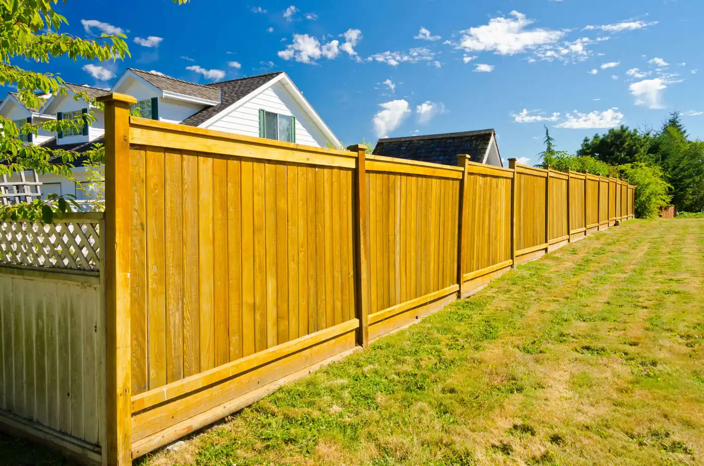 Vertical wood privacy fence installed in a Pflugerville backyard