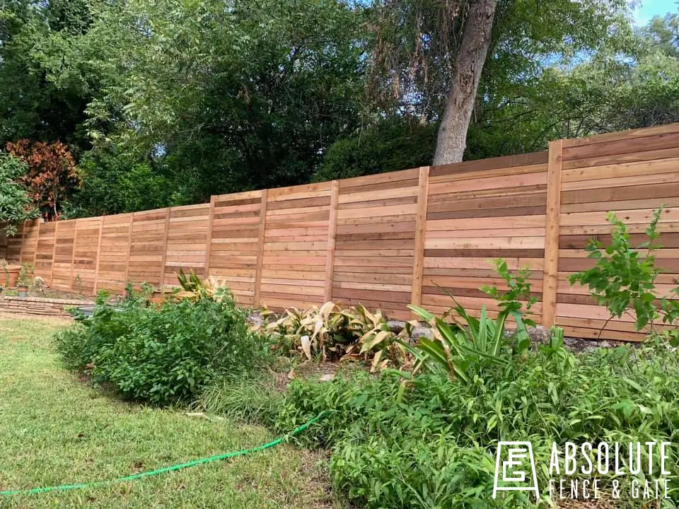 Horizontal cedar wood fence installed by Absolute Fence & Gate in an Austin backyard